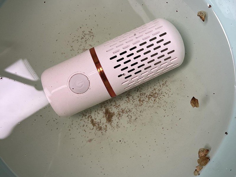 PurePod in dirty water with visible wax and residue